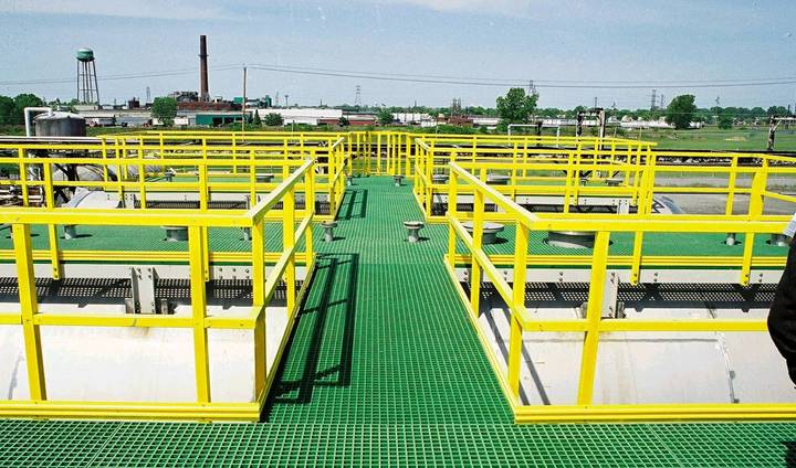 FRP/GRP walkways system with green gratings and yellow handrails.